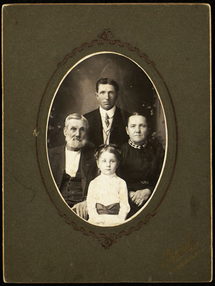 Picture of Grandpa Underhill, Aunt Lucie, and two cousins